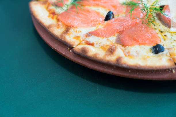 Pizza smoke salmon with lemon slice