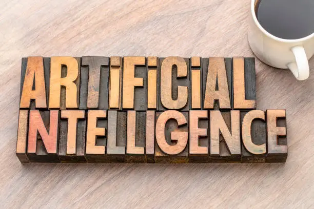 artificial intelligence word abstract in vintage letterpress wood type with a cup of coffee