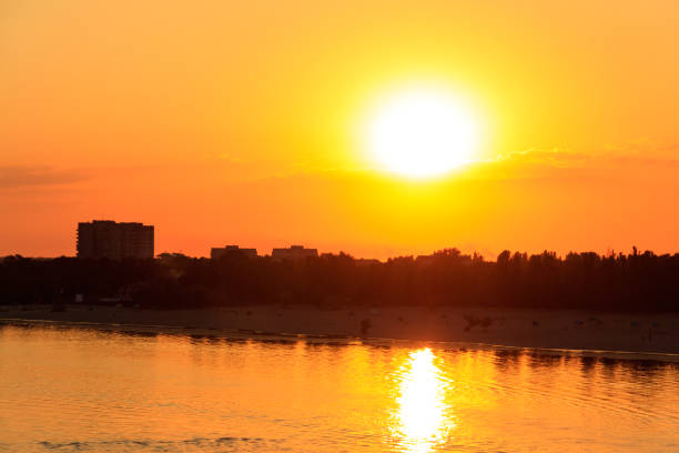istock Orange sunset over a river Dnieper in Kremenchug city, Ukraine 997340566