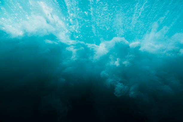 istock Breaking ocean wave is underwater. Ocean texture in underwater 997341678