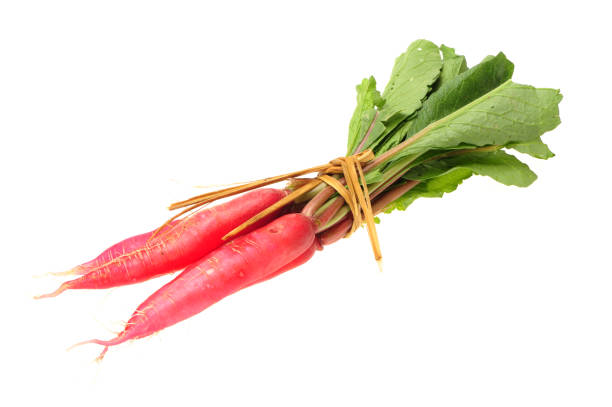 istock White leaves and long red radish  on a white background 997341698