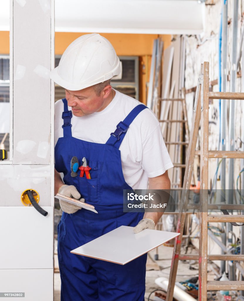 Contractor Installing Ceramic Tile Stock Photo - Download Image Now ...