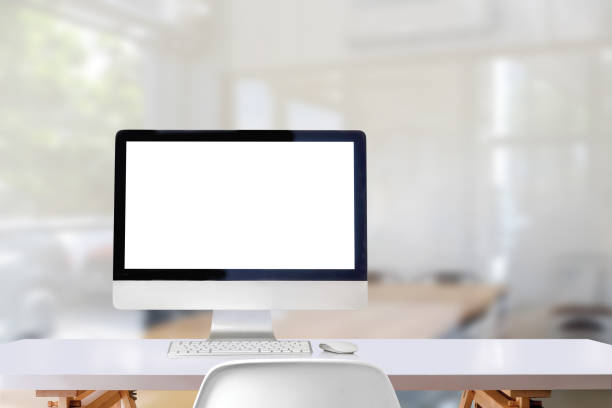 istock Comfortable workplace with mockup desktop computer on white wooden desk in office 997350522