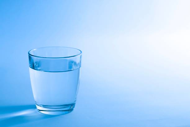 istock Glass of water in blue 997350868