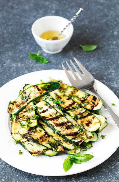 istock Grilled zucchini with basil and olive oil 997355082