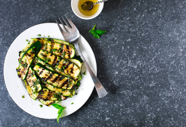 istock Grilled zucchini with basil and olive oil 997355838