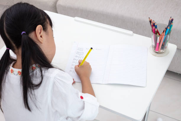 istock Asian Little Chinese girl doing homework 997366322