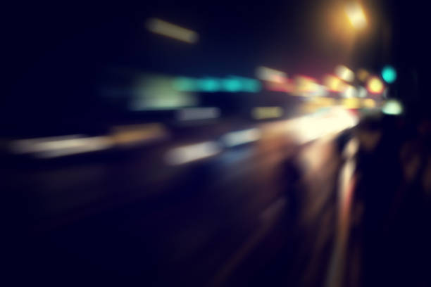 Urban view on Hong Kong city night highway with cars and street blurred lamps. Abstract stylish urban backgrounds. Defocused lights, style color tone, design concept. Copy ad text space, wallpaper