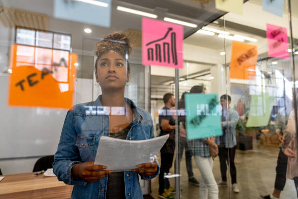 istock Woman brainstorming at a creative office 997373900