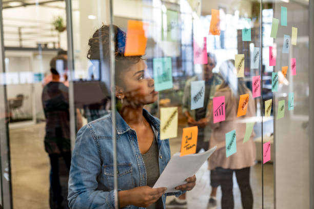 istock Thoughtful woman brainstorming at a creative office 997374050