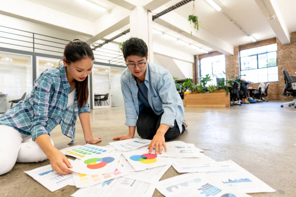 istock Asian team working together at a creative office making a business plan 997374056