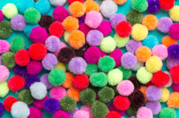 istock A colorful of Pom Pom background 997377038