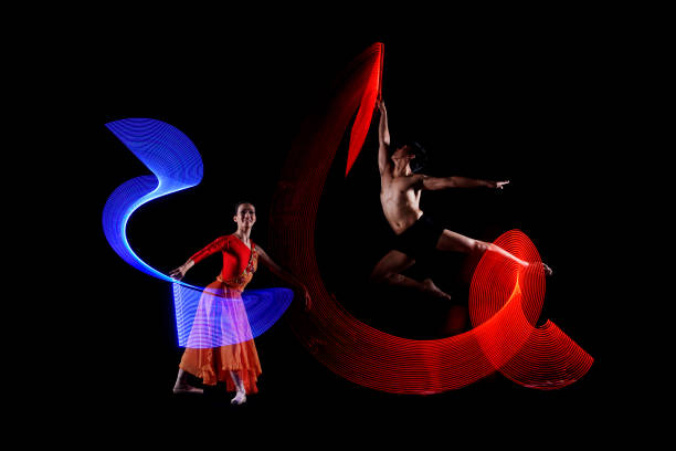 istock Attractive couple ballet dancer with colorful lights effect 997381452