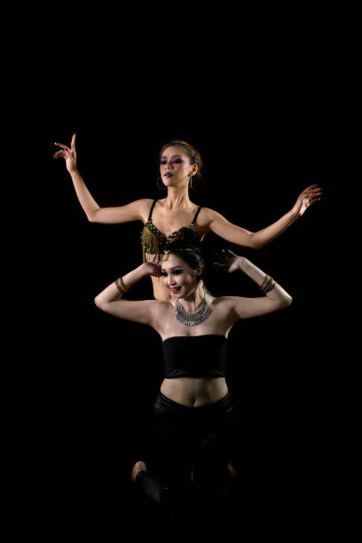 istock Attractive two asian woman showing belly dance 997382586