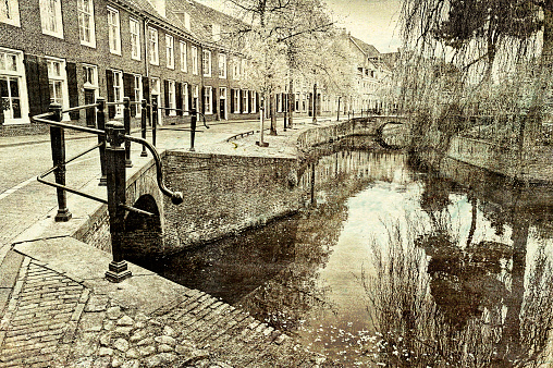 Urban scene in Amersfoort with typical local architecture. Embankment in the historical center of Amersfoort in the Netherlands. Vintage style toned picture