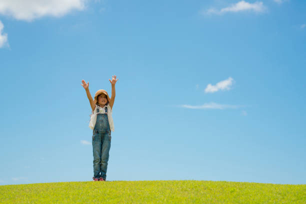 istock Girl playing in the meadow 997396654