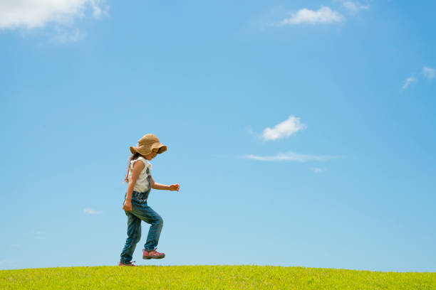 Girl playing in the meadow