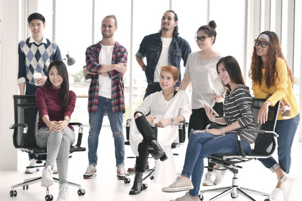 istock Group of business people smiling in office 997428266