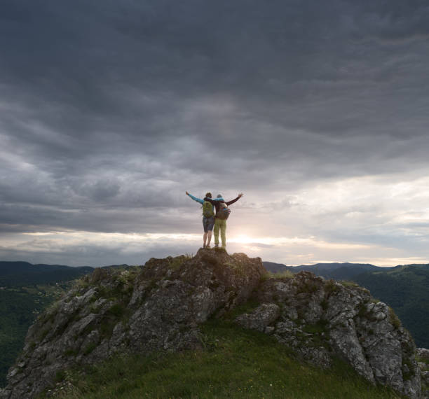 istock Friends celebrating their success on the mountain 997445236