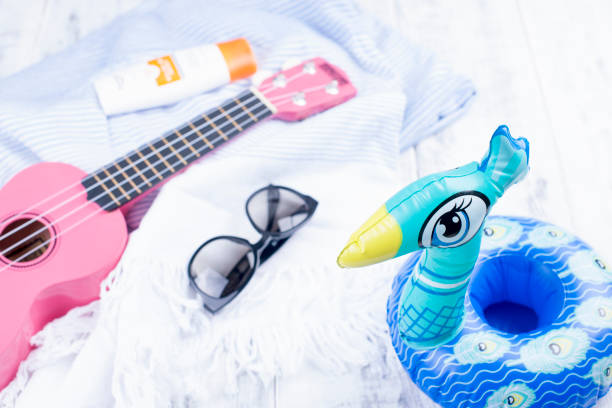 istock Beach accessories, guitar and sunglasses. Good vacations. Copy space 997463334
