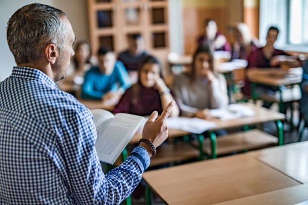 istock High school teacher giving lecture in the classroom. 997463424