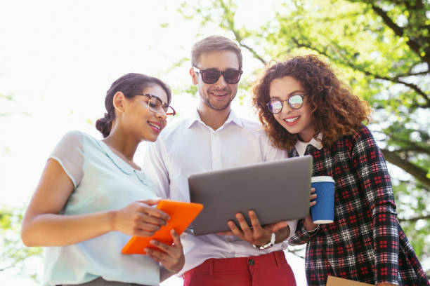 istock Happy male student holding his laptop 997482822