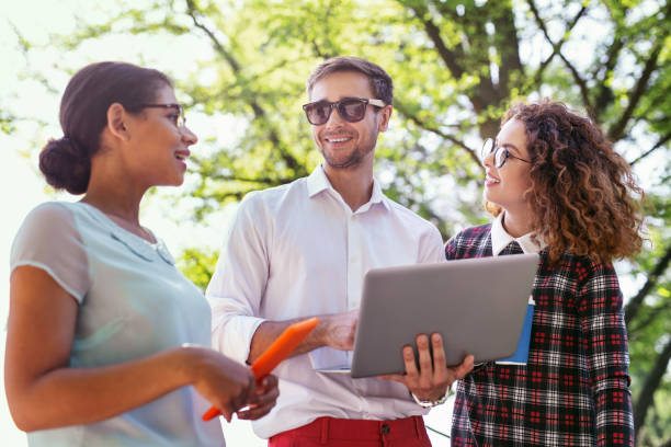 istock Cheerful male student holding his laptop 997482854