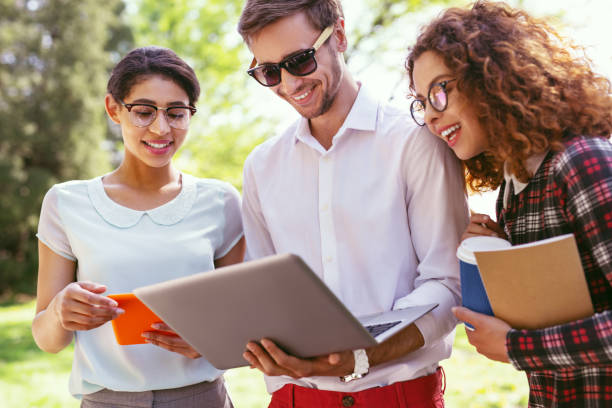 istock Content male student holding his laptop 997483082
