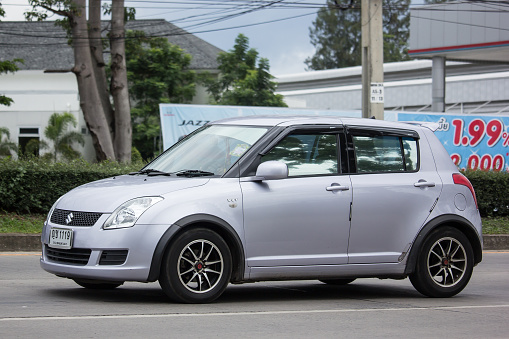 Chiangmai, Thailand - June 21 2018: Private Eco city Car Suzuki Swift. Photo at road no.121 about 8 km from downtown Chiangmai, thailand.