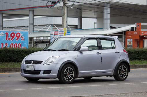 Chiangmai, Thailand - June 21 2018: Private Eco city Car Suzuki Swift. Photo at road no.121 about 8 km from downtown Chiangmai, thailand.