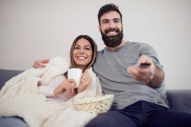 istock Young couple relaxing in their apartment,having great time together 997495940