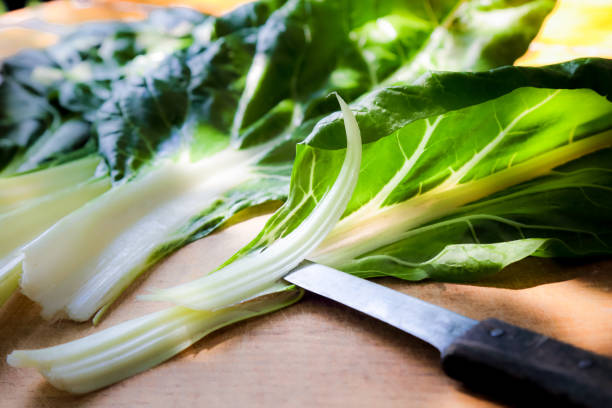 istock Fresh Green Chard Leaves on table outdoor 997496602