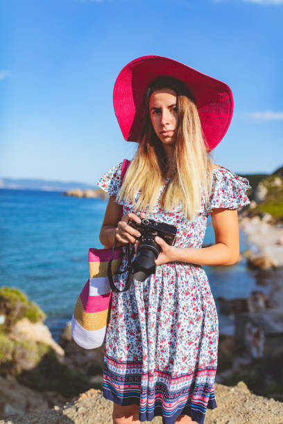 istock Teenage girl holding a camera 997500000