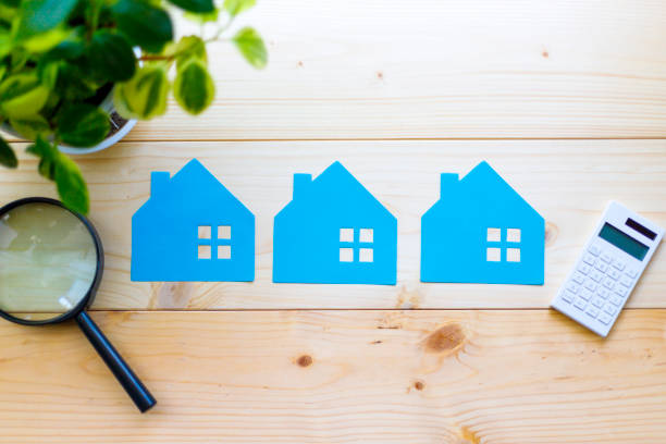 istock Houses and magnifying glass 997504704