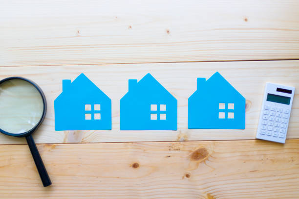 istock Houses and magnifying glass 997504894