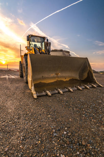 istock Excavator at the end of a working day at a construction site 997505386