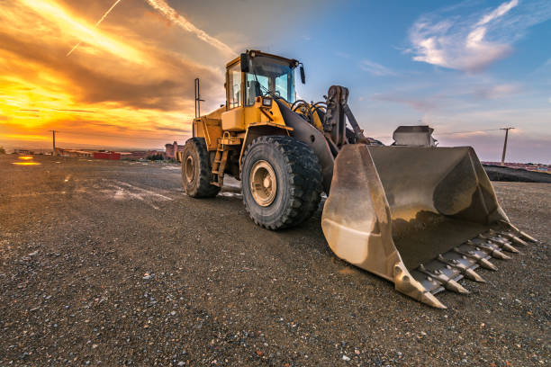 istock Excavator at the end of a working day at a construction site 997505406
