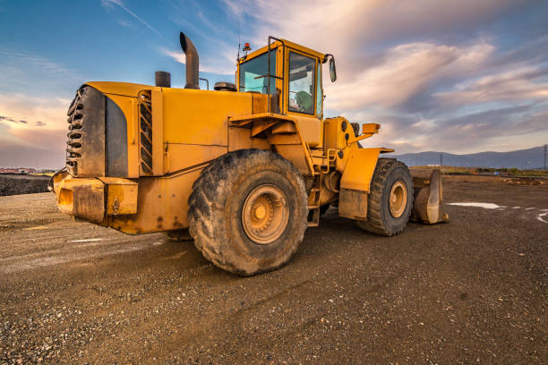 istock Excavator at the end of a working day at a construction site 997505420