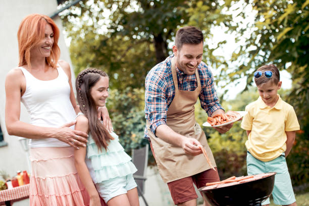 istock Happy family having barbecue 997507842