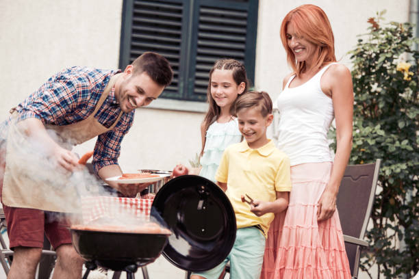istock Happy family having barbecue 997507876