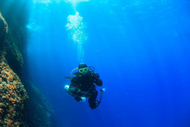 istock Underwater, underwater photographer Technical Diving Scuba diver Exploring and enjoying   Sea life  Water sports  Techdive Scuba diver point of view 997508580