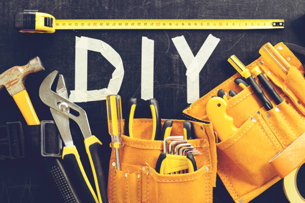 istock top view close-up of tool belt with construction tools and word 997509050