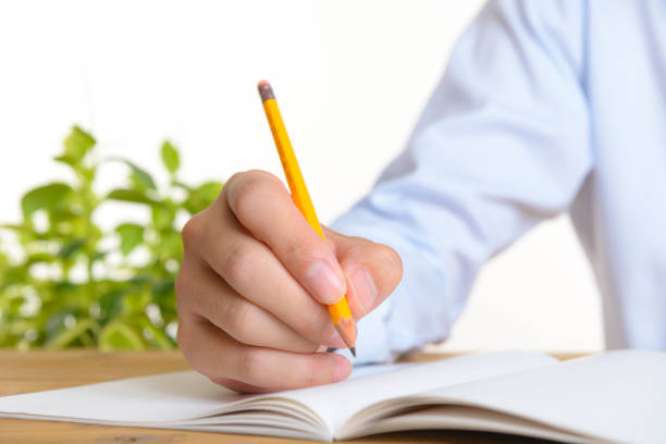 istock Pencil and hands of men 997512582