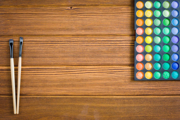 istock wooden background with cosmetics 997517244
