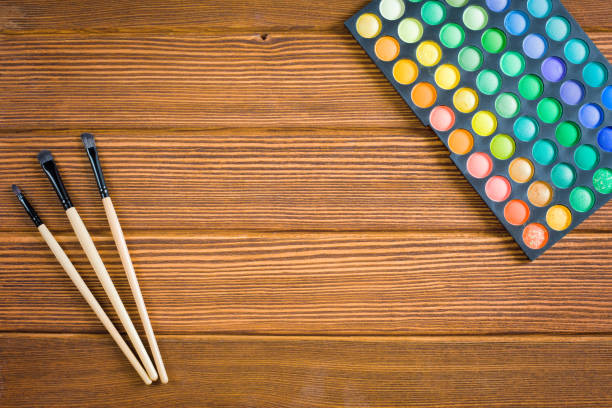 istock wooden background with cosmetics 997517410