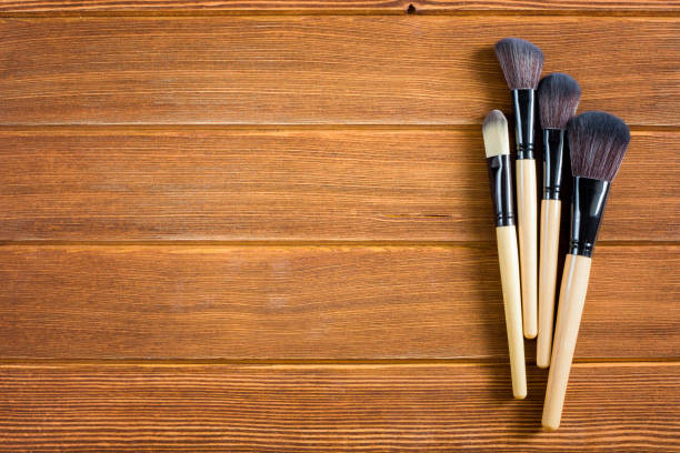 istock wooden background with cosmetics 997517706