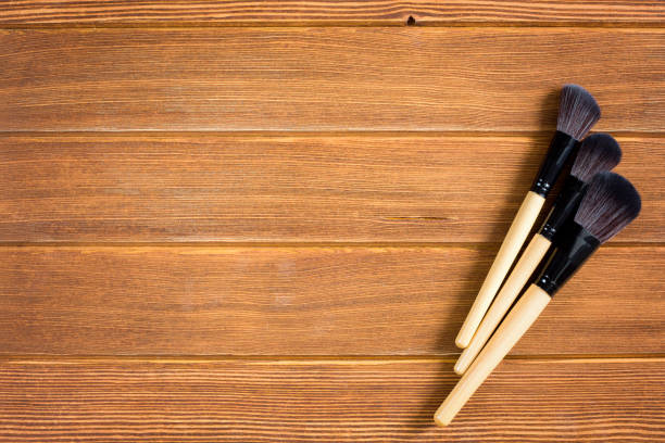 istock wooden background with cosmetics 997517830