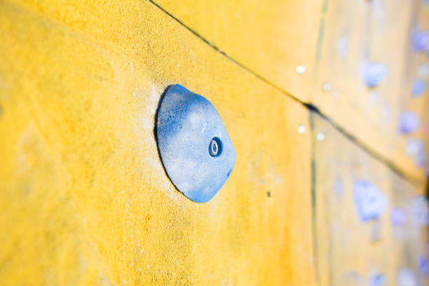 istock Grips of climbing wall 997518530