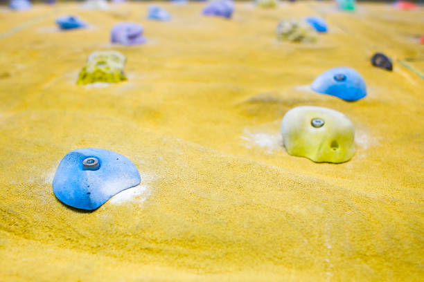 istock Grips of climbing wall 997518658