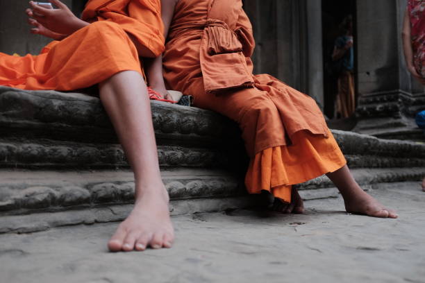 istock Khmer Novices sitting at Angkor Wat 997532624